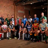 The 16 captains with the Rugby League World Cup Trophy ahead of first round of fixtures