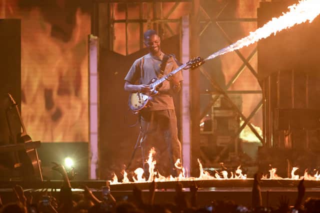  Dave - who picked up the award for Best Hip Hop/Grime/Rap Act - jumped onto the electric guitar and delivered a solo so hot it generated flames