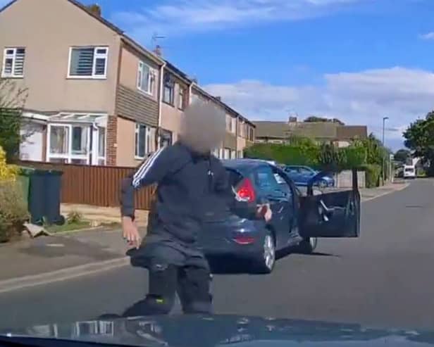 Road rage driver jumps out of car to confront motorist