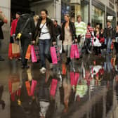 People walk past a Topshop and Topman store on Oxford Street in October 2006 (Photo: Scott Barbour/Getty Images)