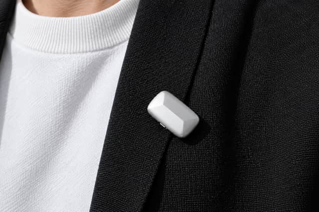 There's a neat lapel clip available, but unfortunately you have to pay extra for it