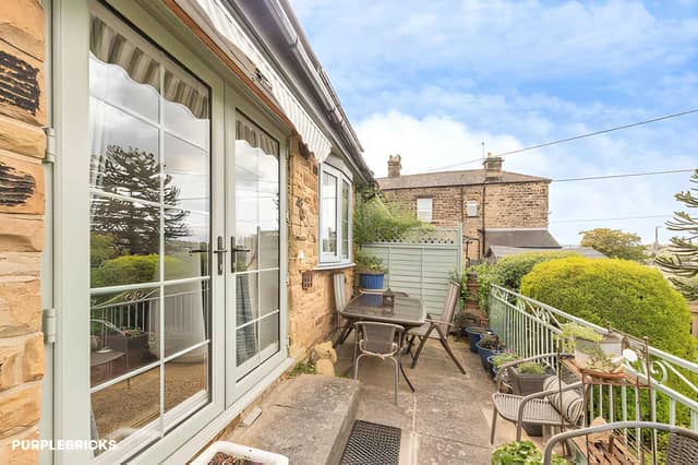 The Crackenedge Lane home has an enclosed front garden with patio