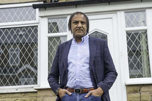 Mr Ahmed stood outside his home in Savile Town