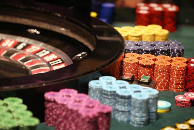 Chips pile up next to a roulette wheel  (Photo by Peter Macdiarmid/Getty Images)