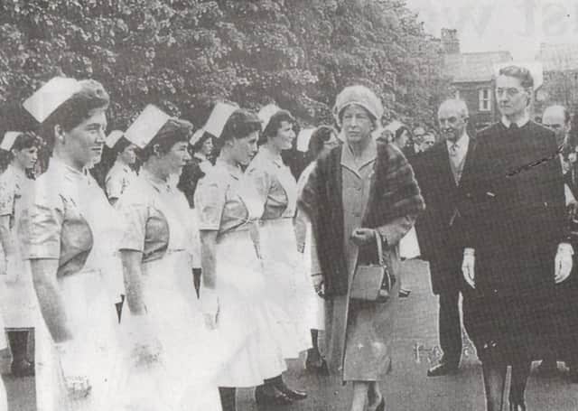 Smart staff: Nurses at Staincliffe General Hospital stand in military style to be inspected by the Princess Royal who visited the hospital in 1960. She is accompanied by Sister Dorothea Wood. Note how their crisp white uniforms and starched caps, and they are even wearing gloves!
