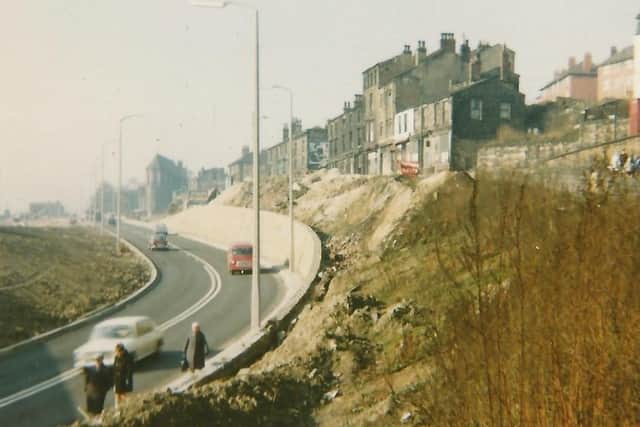 The embankment at the bottom of Huddersfield Road. The road to be widened can be seen clearly here.
