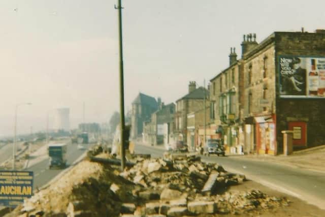 This photo was taken when half the properties had been demolished. Note the rubble on the other side of the road. St Paulinus Church can be seen in the far distance.