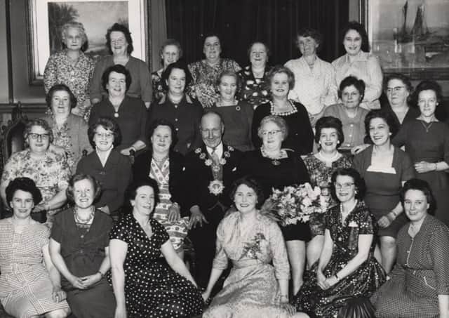 Tea party: The late councillor and Mrs Tom Tarney, Mayor and Mayoress of the old County Borough of Dewsbury, are pictured in 1960 in Dewsbury Town Hall, with Mrs Tarney’s work colleagues who she invited to a special tea party. Photograph provided by Mr and Mrs Tarney’s daughter Catherine.