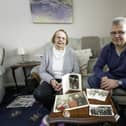 Beverley Greenwood with Mark Greenwood and the photos of her father-in-law and Mytholmroyd firefighter Clifford Greenwood. Photo by Allen McKenzie.