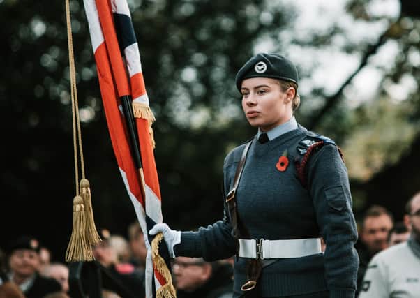 Honour: CWO Baillie carrying the Union Standard at the Remembrance Day Parade 2019.