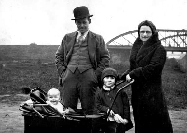 Dangerous times: The Hartley family from Savile Town who suffered more than most when the bombs dropped on Dewsbury during the war. Pictured are Mr and Mrs Dennis Hartley and their two daughters, Brenda, in the pram, and her sister Joyce, standing.