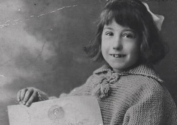 Brave girl: Dewsbury’s little heroine, Laura Walmsley (maiden name Briggs) who saved a child from drowning in 1919, pictured with her bravery award presented by the Royal Humane Society. This picture is kindly loaned by her son, Nolan Walmsley.