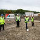 Leader of Kirklees Council Cllr Shabir Pandor (centre) with Dawn Stephenson, Chair of KAL Trustees, Cllr Graham Turner and staff from Kier on site for the first dig.
