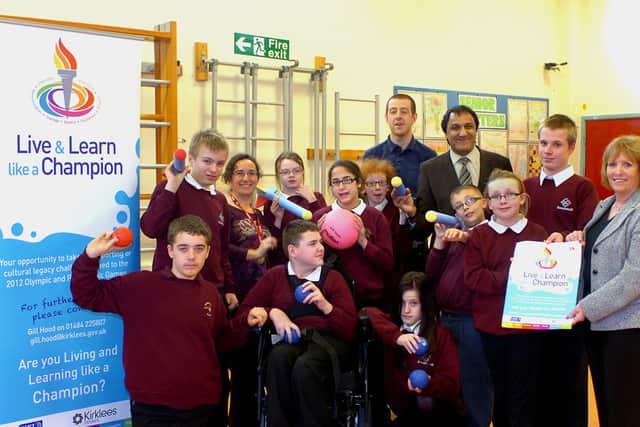Staff and pupils at Ravenshall School celebrating when it was announced the paralympic torch relay route would pass the Kirklees.