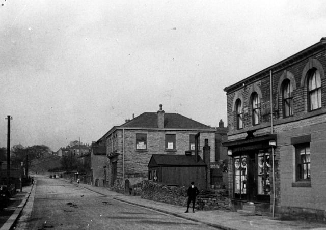 Can you name this shop?: A glimpse of old Dewsbury Moor which many years ago was described as Moor Bottom, of which Mr Oldfield wrote 150 years ago. This photograph was taken either at the bottom of Moorend Lane or it could have been somewhere on Heckmondwike Road.
