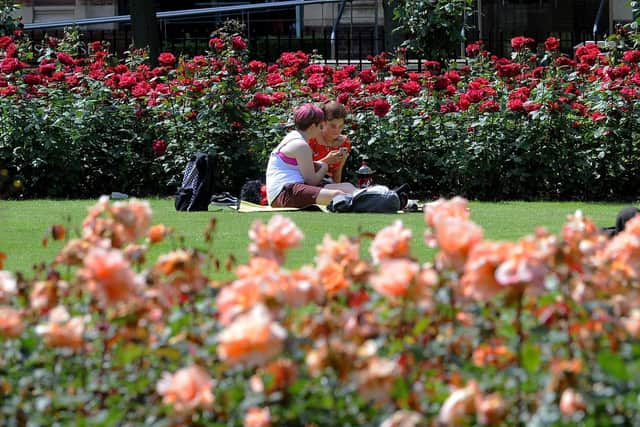Sunbathers in Park Square in Leeds on the hottest day of the year in England. Photo: Simon Hulme