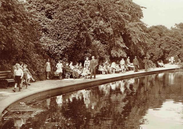 Big attraction: A sunny day in Crow Nest Park, Dewsbury,  which was always the place to be in the 1950s when it is believed this picture was taken. The lake was always a big attraction, especially for the children. Picture kindly loaned by Stuart Hartley.
