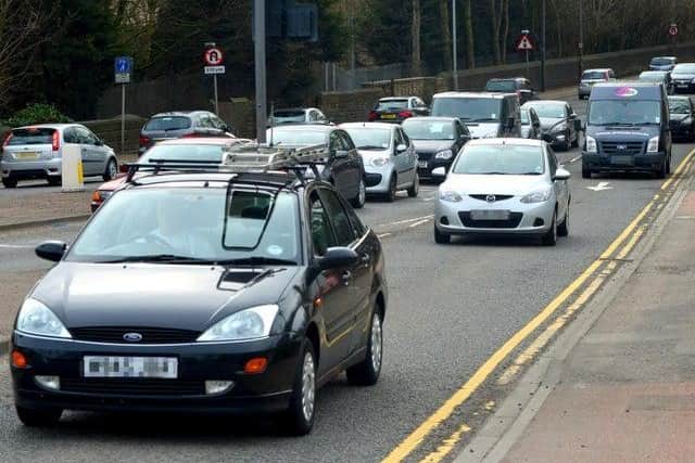 Safe air pollution limits are being breached in a dozen areas across Kirklees analysis suggests