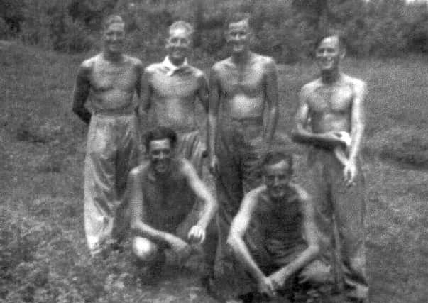 Free from tyranny: Les Main, kneeling left and pictured inset, is pictured with his comrades after being liberated from a prisoner of war camp. The picture was taken after the men had put on some weight – before that they were little more than skin and bone.