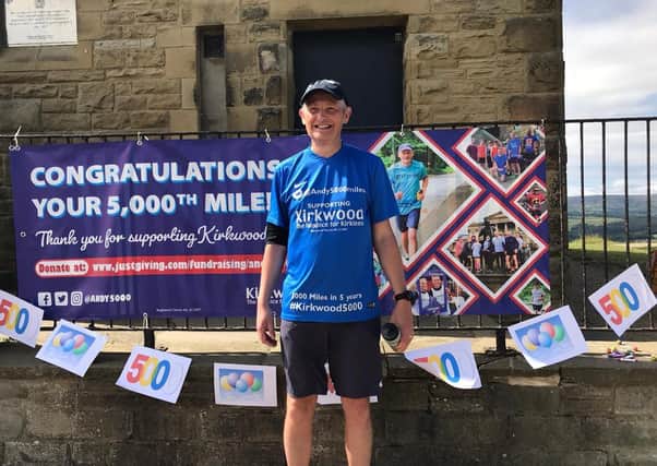 Summit: Andy Wright completed his 5,000-mile challenge after reaching the top of Castle Hill.