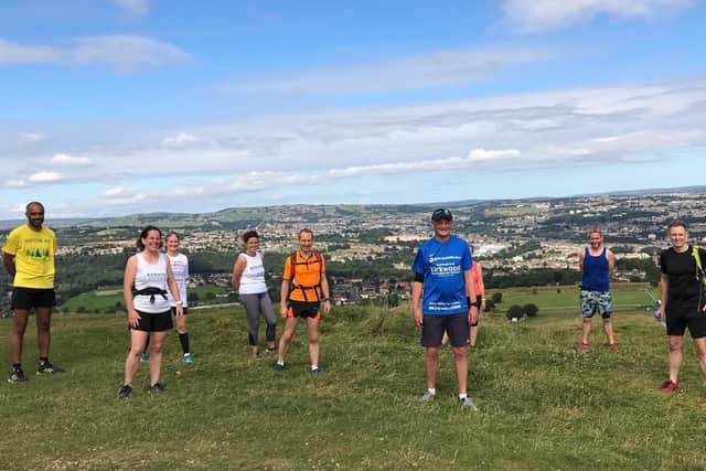 Support: Runners join Mr Wright on the run up Castle Hill.