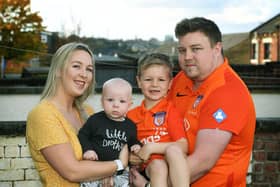 To help with his grief Alex Walmsley set up SANDS United Huddersfield,  a football team of dads and other family members affected by baby loss. Pictured with wife Olivia and Toby (7 months) and Isaac (7).