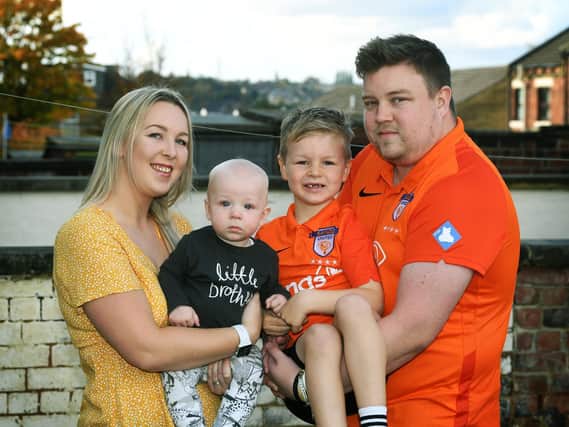To help with his grief Alex Walmsley set up SANDS United Huddersfield,  a football team of dads and other family members affected by baby loss. Pictured with wife Olivia and Toby (7 months) and Isaac (7).