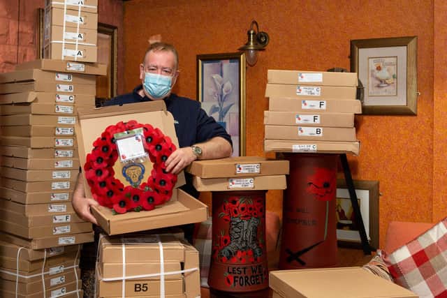 Tim Wood, with poppy wreaths, at the Old Colonial Inn, Dunbottle Lane, Mirfield