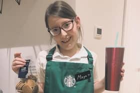 Maya with some of the Starbucks goodies sent to her by a manager of two Starbucks branches in Leeds. The manager had seen her fundraising efforts online and clubbed together with a district manager to send her a thank you package.