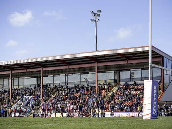 Fans watch a game at the Tetley's Stadium.