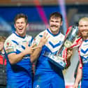 Picture by Allan McKenzie/SWpix.com - 27/11/2020 - Rugby League - Betfred Super League Grand Final - Wigan Warriors v St Helens - KC Stadium, Kingston upon Hull, England - Louie McCarthy-Scarsbrook, Alex Walmsley & Kyle Amor celebrate with the Betfred Super League Trophy.