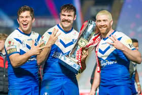 Picture by Allan McKenzie/SWpix.com - 27/11/2020 - Rugby League - Betfred Super League Grand Final - Wigan Warriors v St Helens - KC Stadium, Kingston upon Hull, England - Louie McCarthy-Scarsbrook, Alex Walmsley & Kyle Amor celebrate with the Betfred Super League Trophy.