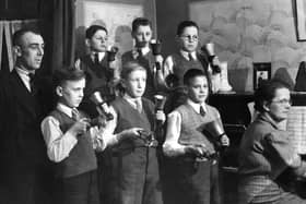 Tuning up: These children from St Peter’s Church, Earlsheaton, played these bells at concerts throughout the district. They are pictured here in 1946 practising at the home of their conductor Mr Crossland and his wife Winnie, who accompanied them on the piano. Pictured from left to right on the back row are: David Lumb, John Pickard and Tom Overend. On the front row, Malcolm Crossland, Derrick Wainwright and Clarence Simpson.