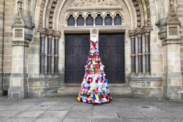 The knitted Christmas tree outside  Longcauseway Church in Dewsbury