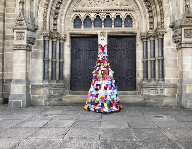 The knitted Christmas tree outside  Longcauseway Church in Dewsbury