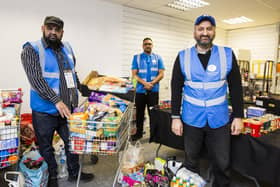 From the left, Idris Yousaf, Qumar Uddin and Arif Ahmad at Humanity First food bank, Mirfield.