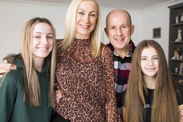 Zoe Shackleton, second from left, who has been shortlisted in a songwriting competition, with huband Mike and daughters Lily, 16, left, and Molly, 14, right.