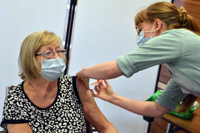 A member of the public receiving their Covid-19 vaccination