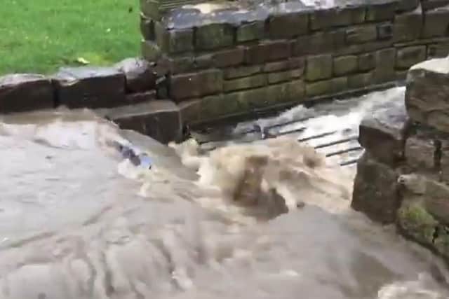 Floodwater overwhelms Valance Beck as it enters a culvert at Hagg Lane in Mirfield. (Image: Veronica Maher)