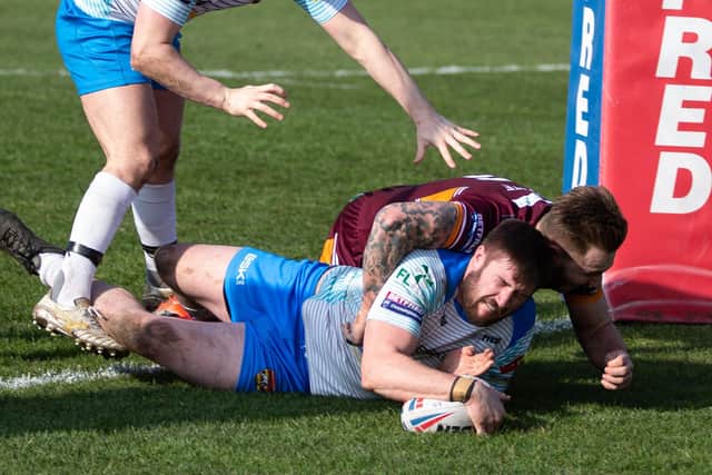 Dewsbury Rams' Aaron Hall goesover between the posts for his side’s first try against Batley Bulldogs. Picture: Bruce Fitzgerald.