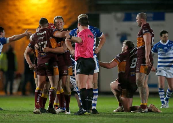 Batley Bulldogs players celebrate their victory at Halifax yesterday. Picture: Ed Sykes/SWpix.com.