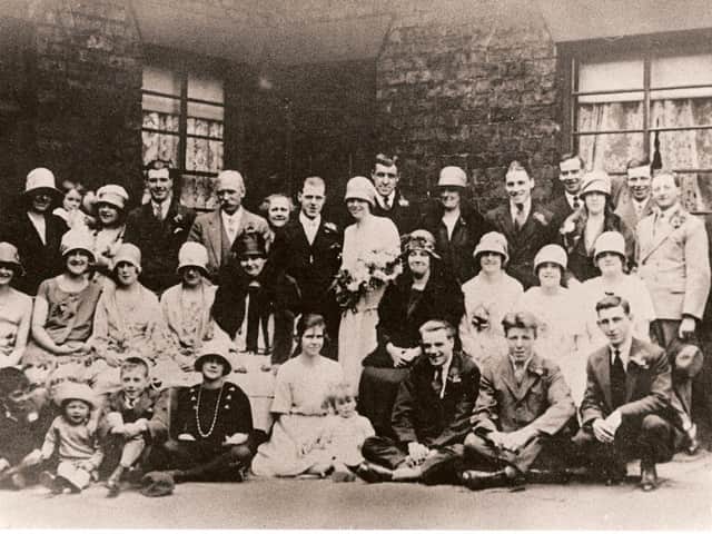 THE HAPPY COUPLE: Minnie Gallagher and Herbert Blacker, pictured with their families outside the home of Laura and Wilfred Gallagher.