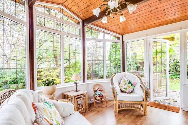 Sun room surrounded by gardens