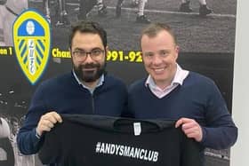 Leeds United's Victor Orta and Angus Kinnear holding an Andy's Man Club t-shirt. Copyright: other