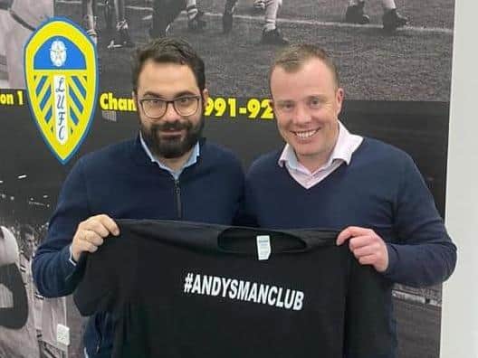 Leeds United's Victor Orta and Angus Kinnear holding an Andy's Man Club t-shirt. Copyright: other