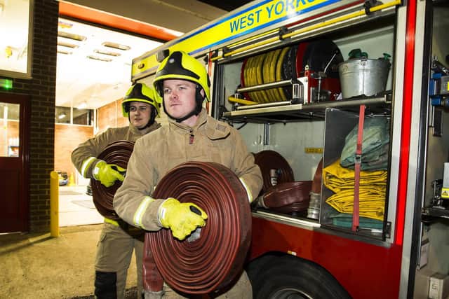 Mytholmroyd Fire Station. Matthew Bairstow, left, and Ross Martin kitted out and ready to go. Photo by Jim Fitton.
