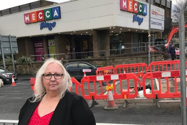 Coun Cathy Scott by the new pedestrian crossing on Railway Street in Dewsbury, which is being put in place to allow easier access for shoppers to the retail park