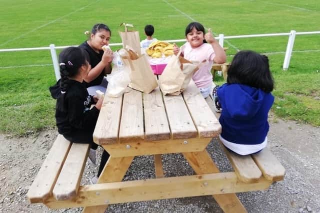 Young people enjoying their free meal provided at the healthy holiday scheme last summer.