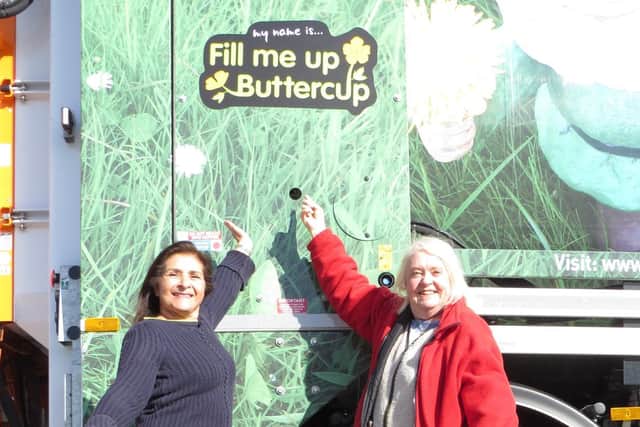 Coun Naheed Mather and Stephanie Buckley with Fill me up Buttercup, one of Kirklees Council's new garden waste collection wagons