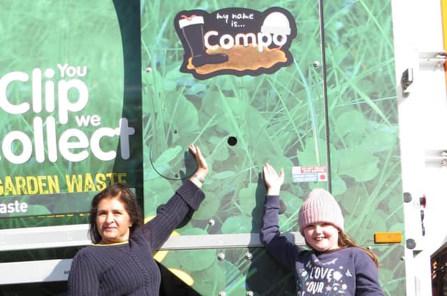 Coun Naheed Mather and Emily Dixon, eight, with Compo, one of Kirklees Council's new garden waste collection wagons